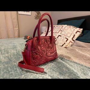 Red embossed vegan leather bag
